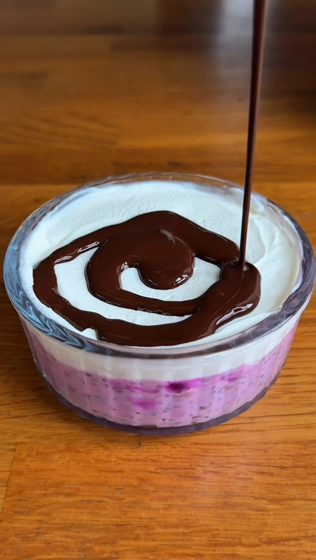 Raspberry chia pudding with yogurt and melted chocolate