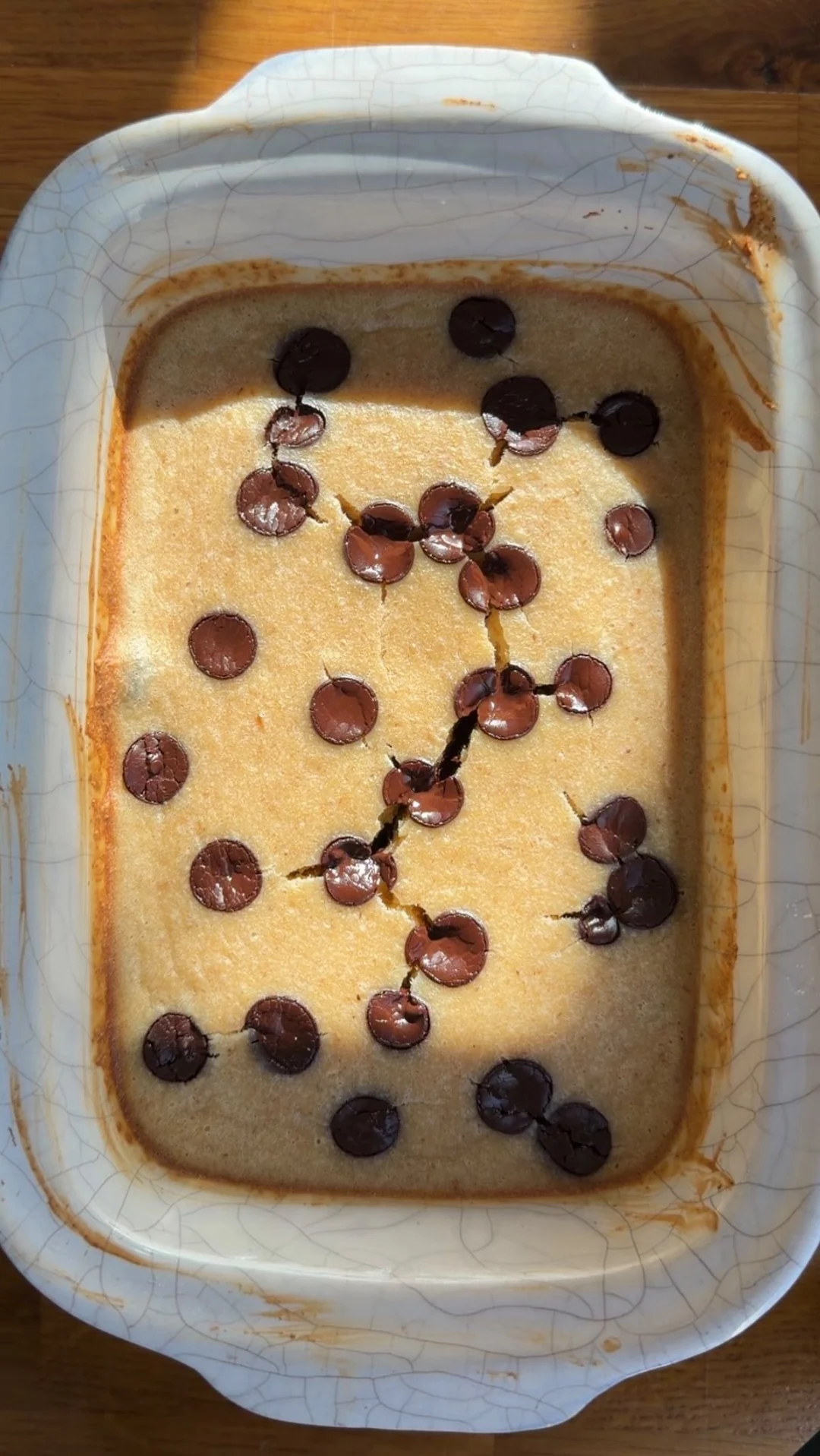 Chocolate chip oat bake in a rectangular white ceramic dish